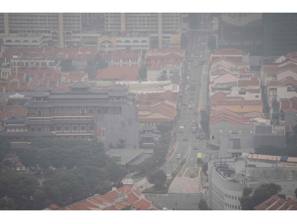 A general view of Chinatown in Singapore on October 16, 2026, as the country continues to be shrouded in haze caused by fires in Indonesia. (Photo by Yuichi Yamazaki / AFP)
