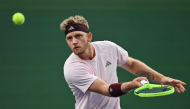 Spain's Alejandro Davidovich Fokina hits a return to Germany's Alexander Zverev during their men's singles semi-final match at the Shanghai Masters tennis tournament in Shanghai on October 17, 2026. (Photo by Hector Retamal / AFP)