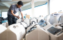 A technician inspects oxygen concentrators awaiting repair and cleaning at a medical supply warehouse in Kuala Lumpur on October 15, 2026. (Photo by Mohd Rasfan / AFP) 