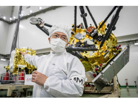 (FILES) Yasuhiro Kawakatsu, project manager of the Mars Moons eXploration (MMX) mission, speaks to media in front of the MMX spacecraft at the Tanegashima Space Center in Minamitane, Kagoshima prefecture on August 13, 2026. (Photo by Yuichi YAMAZAKI / AFP) 