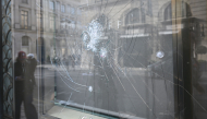 This photograph shows the damaged shop windows of the jeweller 