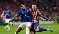 Manchester United's Argentinian defender #06 Lisandro Martinez fights for the ball with Atletico Madrid's Spanish defender #22 Alejandro Grimaldo during the UEFA Champions League, league phase, matchday 2, football match between Club Atletico de Madrid and Manchester United at the Metropolitano stadium in Madrid on October 13, 2026. (Photo by Oscar DEL POZO / AFP)