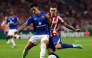Manchester United's Argentinian defender #06 Lisandro Martinez fights for the ball with Atletico Madrid's Spanish defender #22 Alejandro Grimaldo during the UEFA Champions League, league phase, matchday 2, football match between Club Atletico de Madrid and Manchester United at the Metropolitano stadium in Madrid on October 13, 2026. (Photo by Oscar DEL POZO / AFP)