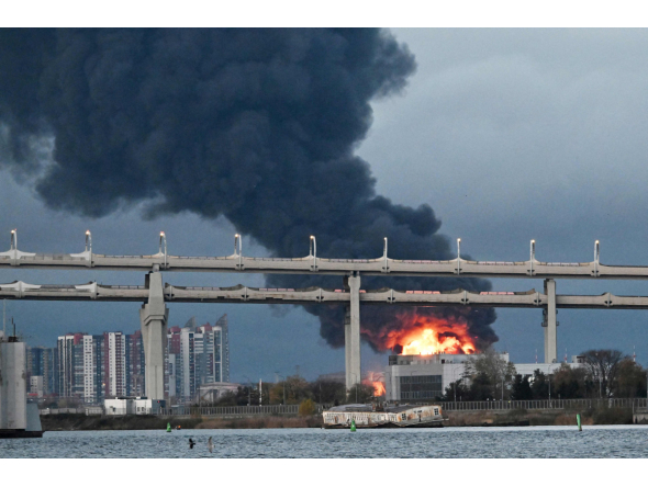 Smoke rises above the city following an air attack on the oil terminal in Saint Petersburg on October 18, 2026, amid the ongoing Russian-Ukrainian conflict. (Photo by AFP)