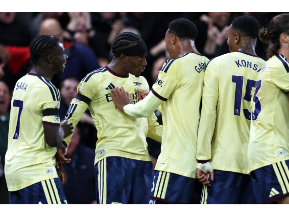 Arsenal's English midfielder #20 Noni Madueke (2L) celebrates scoring the team's first goal with teammates during the English Premier League football match between Nottingham Forest and Arsenal at The City Ground in Nottingham, central England, on October 18, 2026. (Photo by Darren Staples / AFP) 