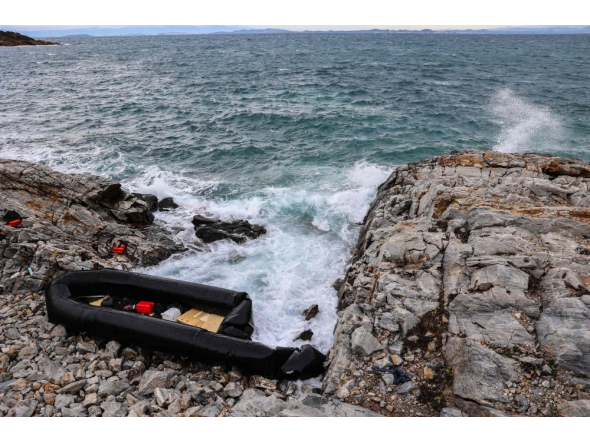 (Files) This photograph taken on January 10, 2024, shows an inflatable dinghy washed up on the rocky shores of Agios Georgios, east of the Greek island of Lesbos in the Aegean Sea. (Photo by Manolis Lagoutaris / AFP)