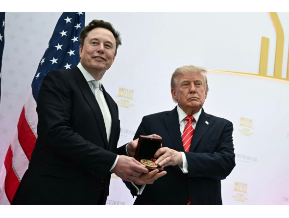 (Files) US President Donald Trump presents the National Medal of Science to Elon Musk during the 