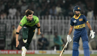 Pakistan's captain Shaheen Shah Afridi (L) bowls as Sri Lanka's Pavan Rathnayake watches during the tri-series one-day international (ODI) cricket match between Pakistan and Sri Lanka at the Rawalpindi Cricket Stadium in Rawalpindi on October 18, 2026. (Photo by Aamir QURESHI / AFP)