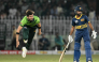 Pakistan's captain Shaheen Shah Afridi (L) bowls as Sri Lanka's Pavan Rathnayake watches during the tri-series one-day international (ODI) cricket match between Pakistan and Sri Lanka at the Rawalpindi Cricket Stadium in Rawalpindi on October 18, 2026. (Photo by Aamir QURESHI / AFP)
