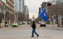 An Alberta separatist supporter carries a flag ahead of the referendum in downtown Edmonton, Alberta, on October 19, 2026. (Photo by Megan Albu / AFP)