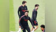 PSG’s Ferran Torres (centre) attends a training session with teammates.