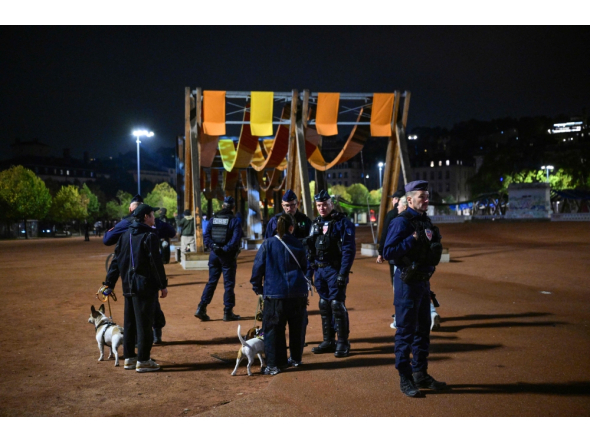French police officers check people during a partial curfew in Lyon on October 19, 2026, following weekend demonstrations. (Photo by Olivier Chassignole / AFP)