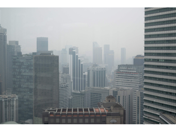High-rise buildings are seen in Kuala Lumpur on October 20, 2026, as Malaysia continues to be shrouded in haze caused by fires in Indonesia. (Photo by Mohd Rasfan / AFP)