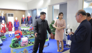 This picture taken on October 19, 2026 and released by North Korea's official Korean Central News Agency (KCNA) on October 20, 2026 shows North Korean leader Kim Jong Un (L) and his daughter Kim Ju Ae (2nd L) inspecting a clothing and footwear exhibition hall in Pyongyang. (Photo by KCNA VIA KNS / AFP) 