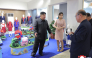 This picture taken on October 19, 2026 and released by North Korea's official Korean Central News Agency (KCNA) on October 20, 2026 shows North Korean leader Kim Jong Un (L) and his daughter Kim Ju Ae (2nd L) inspecting a clothing and footwear exhibition hall in Pyongyang. (Photo by KCNA VIA KNS / AFP) 