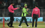 Pakistan's Arafat Minhas (C) celebrates after taking his sixth wicket to dismiss England's Adil Rashid as umpires Pakistan's Faisal Afridi (L) and Bangladesh's Sharfuddoula react during the one-day international (ODI) tri-series cricket match between Pakistan and England at the Rawalpindi Cricket Stadium in Rawalpindi on October 20, 2026. (Photo by Aamir QURESHI / AFP)