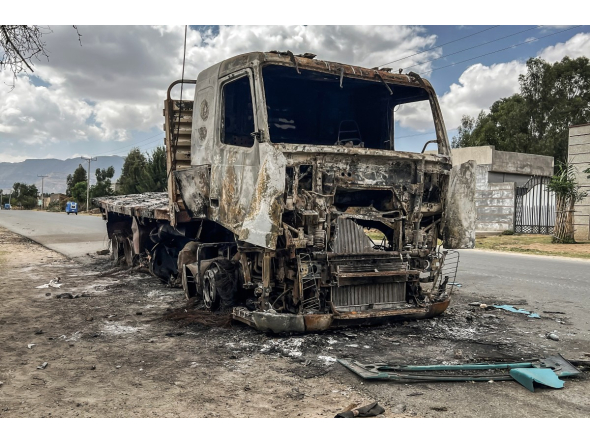 A truck belonging to the Tigray People's Liberation Front (TPLF) stands burned along a road following clashes between Ethiopian federal forces and armed groups opposed to the government in Adigrat on October 17, 2026. (AFP)
