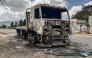 A truck belonging to the Tigray People's Liberation Front (TPLF) stands burned along a road following clashes between Ethiopian federal forces and armed groups opposed to the government in Adigrat on October 17, 2026. (AFP)
