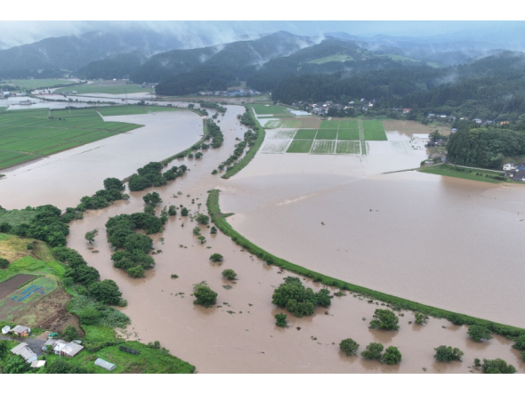 In this file photo July 25, 2024 and released courtesy of the Akita Prefecture River Sabo Division to AFP on July 26, shows flooding along the Ishizawa river, whose embankment collapsed due to heavy rains, in Yurihonjo, Akita prefecture. Photo by Handout / Akita Prefecture River Sabo Division / AFP   