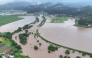 In this file photo July 25, 2024 and released courtesy of the Akita Prefecture River Sabo Division to AFP on July 26, shows flooding along the Ishizawa river, whose embankment collapsed due to heavy rains, in Yurihonjo, Akita prefecture. Photo by Handout / Akita Prefecture River Sabo Division / AFP   
