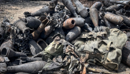Mortar shells and other ammunition remnants lie scattered along a road following clashes between Ethiopian federal forces and armed groups opposed to the government in Adigrat on October 17, 2026. AFP.