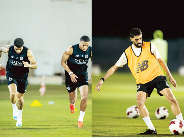 Al Sadd's Paulo Otavio Pedro Miguel and Hassan Al Haydos during a training session. 