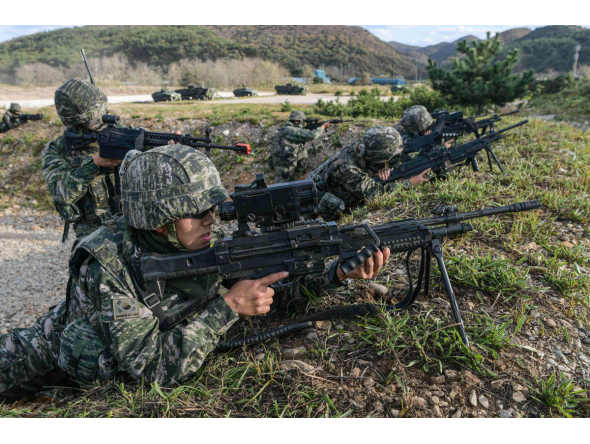 This handout photo taken on October 21, 2026 and provided by the Republic of Korea's Defence Ministry on October 22, 2026 shows South Korean Marines taking part in a comprehensive island defence exercise on Baengnyeong island near the maritime border with North Korea. (Photo by Handout / South Korean Defence Ministry / AFP) 