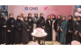QNB Group and QCS officials at a breast cancer awareness event.