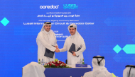 Lusail International Circuit Shared Services Executive Director Abdulrahman Hassen Al Mulla (right) and Ooredoo Qatar Chief Strategy and Digital Transformation Officer Thani Ali Al-Malki shake hands after announcing the partnership.