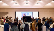 Customers being helped at an Apple store in NYC. Picture from Apple.com