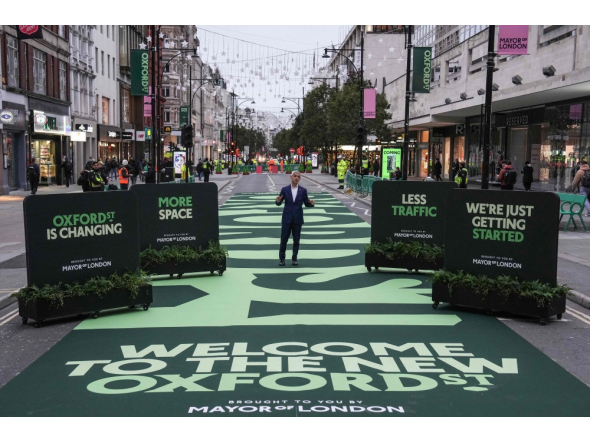 London Mayor Sadiq Khan (C) attends the opening ceremony for a section of Oxford Street, as it goes permanently traffic-free for the first time in central London on October 26, 2026. (Photo by Carlos Jasso / AFP)