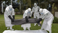 Kenya Red Cross personnel in Personal Protective Equipment (PPE) simulate the evacuation of remains of an Ebola victim in the Kenyan capital Nairobi on October 22, 2026. Photo by TONY KARUMBA / AFP