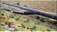 This still image from video taken and released by Spain's Civil Guard on October 28, 2026 shows an aerial scene of a train crash between a high speed Renfe AVE train and Iryo train around 150kms south of Madrid between Urda and Los Yebenes in the province of Toledo. (Photo by Handout / Guardia Civil / AFP)