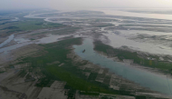 This aerial photograph taken on October 13, 2026, shows wetlands along the Padma river at Ujirpur, near the Bangladesh-India frontier in Bangladesh's Rajshahi division. (Photo by Salahuddin Ahmed / AFP)