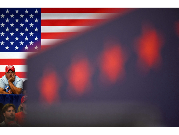  A supporter watches as US President Donald Trump speaks at a midterm campaign rally at Shoemaker Center in Chillicothe, Ohio on October 28, 2026. (Photo by Kent NISHIMURA / AFP)