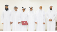 Minister of Awqaf and Islamic Affairs H E Ghanem bin Shaheen bin Ghanem Al Ghanim with officials and honouree during ceremony.