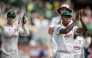 South Africa's Kagiso Rabada (R) and his teammates acknowledge the crowd after winning the match. (Photo by Marco Longari / AFP) 