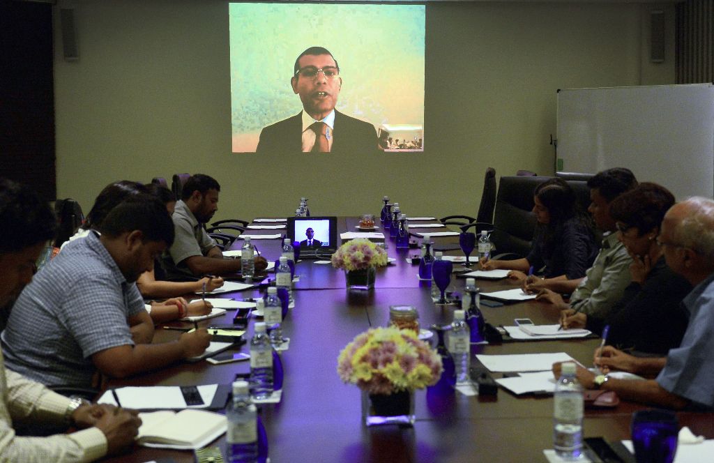 In this photograph taken on September 13, 2016, exiled Maldives opposition leader, Mohamed Nasheed addresses Sri Lanka-based foreign correspondents via video link, in Colombo.   AFP / LAKRUWAN WANNIARACHCHI