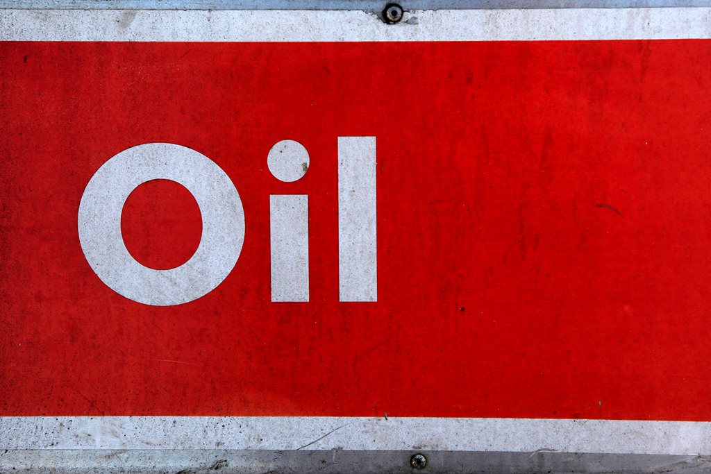 The word oil is pictured on an oil bank at a recycling yard in London. (REUTERS/Stefan Wermuth/File Photo)