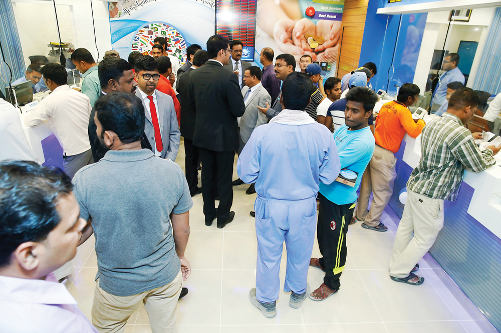 Trust Exchange Company officials and its customers at Regency Shopping Complex in Umm Salal Ali. 