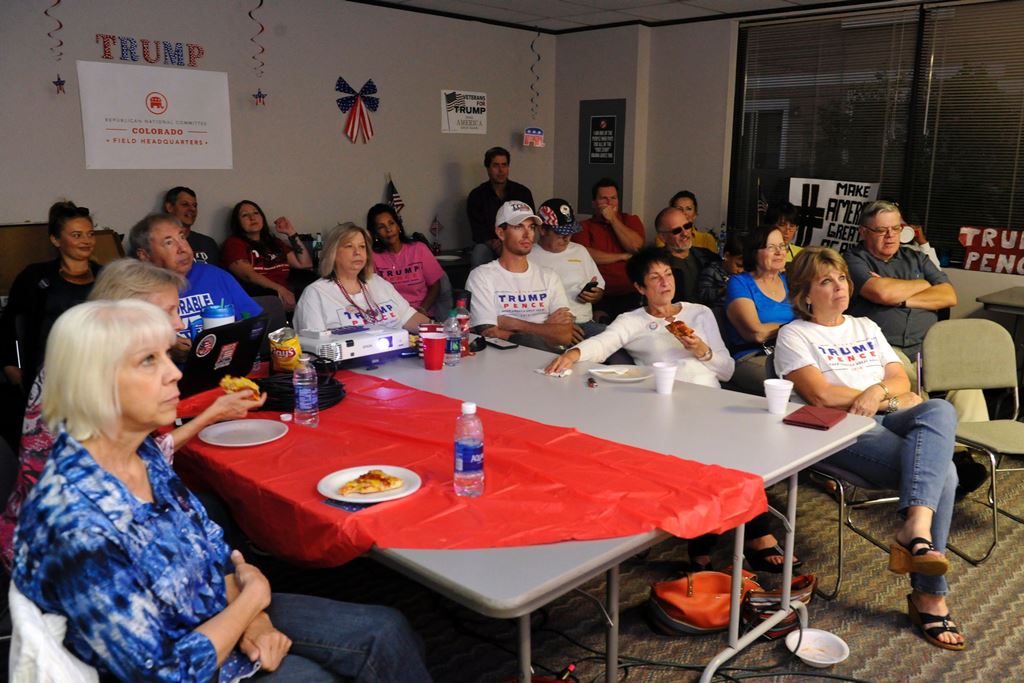 Supporters of Republican presidential nominee Donald Trump watch the first presidential debate between Republican nominee Donald Trump and Democratic presidential nominee Hillary Clinton at the Colorado Republican Party's Adams County Victory Office in Th