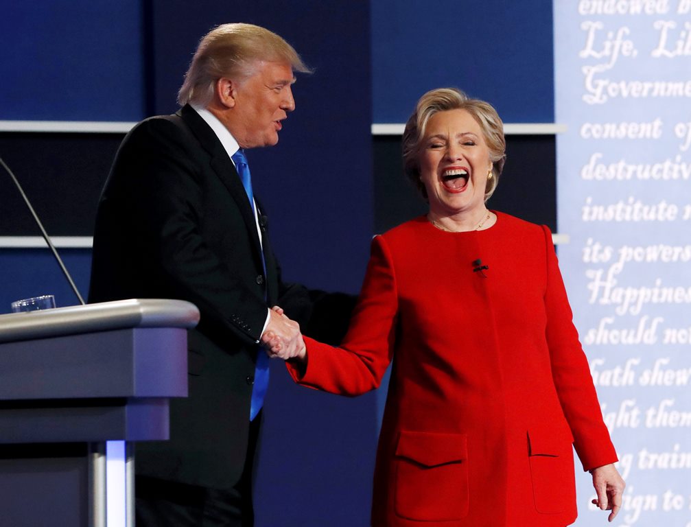 Republican US presidential nominee Donald Trump greets Democratic US presidential nominee Hillary Clinton after their first presidential debate at Hofstra University in Hempstead, New York, US, September 26, 2016. Reuters/Brian Snyder