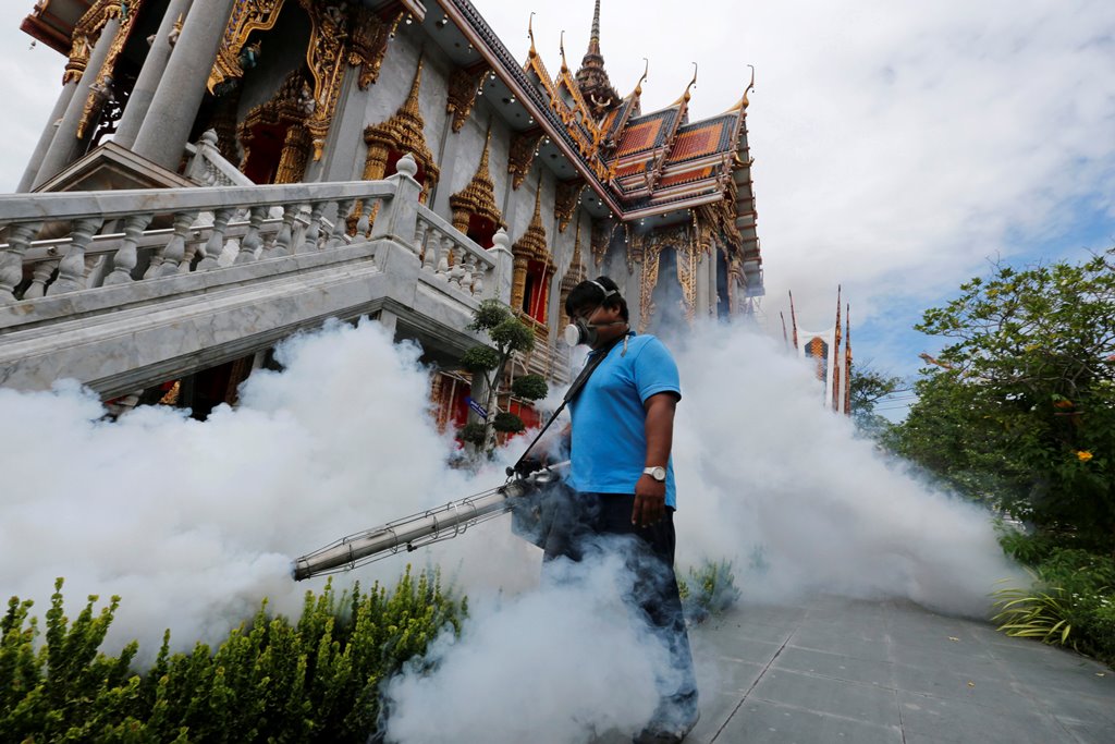 A city worker fumigates the area to control the spread of mosquitoes at a temple in Bangkok, Thailand. Reuters/Chaiwat Subprasom/File Photo