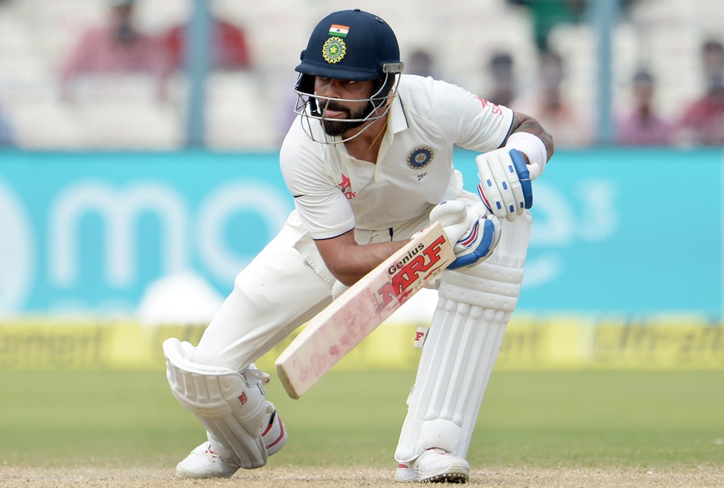 India's captain Virat Kohli reacts after losing his wicket during the third day of the second Test match between India and New Zealand at the Eden Gardens cricket stadium in Kolkata on October 2, 2016. (AFP / Dibyangshu Sarkar)