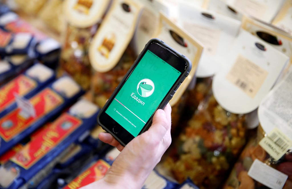 Natalia Shagarina, inventor of Edadeal mobile phone application tracking down discount deals in supermarkets, demonstrates the application at a cafe in Moscow, Russia, October 4, 2016. REUTERS/Maxim Zmeyev