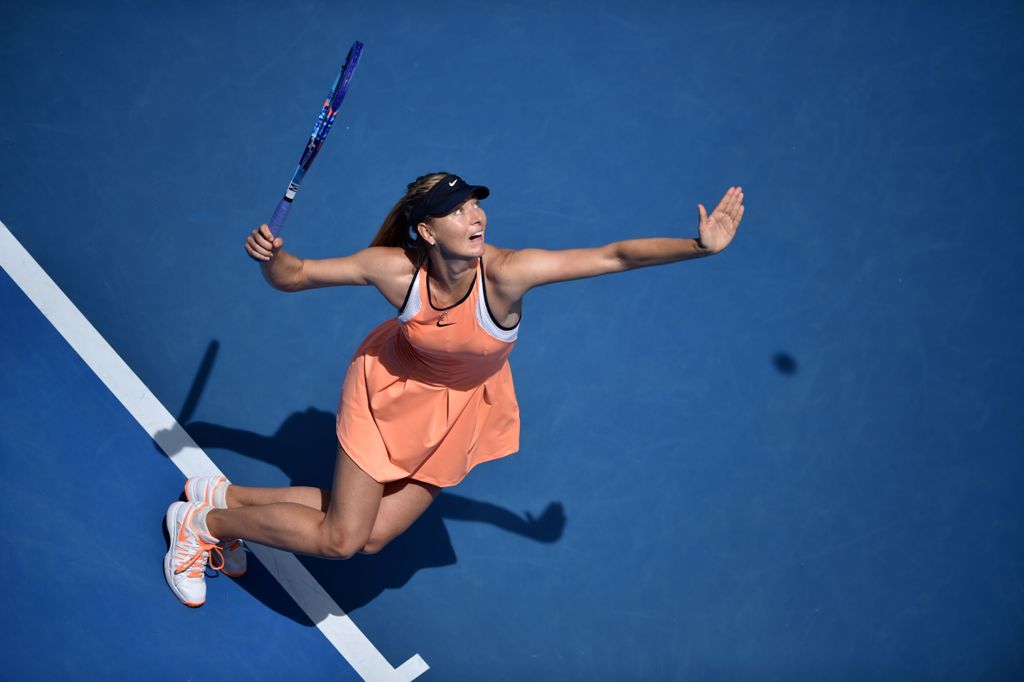(FILES) This file photo taken on January 26, 2016 shows Russia's Maria Sharapova serving during her women's singles match against Serena Williams of the US on day nine of the 2016 Australian Open tennis tournament in Melbourne.  AFP / PETER PARKS