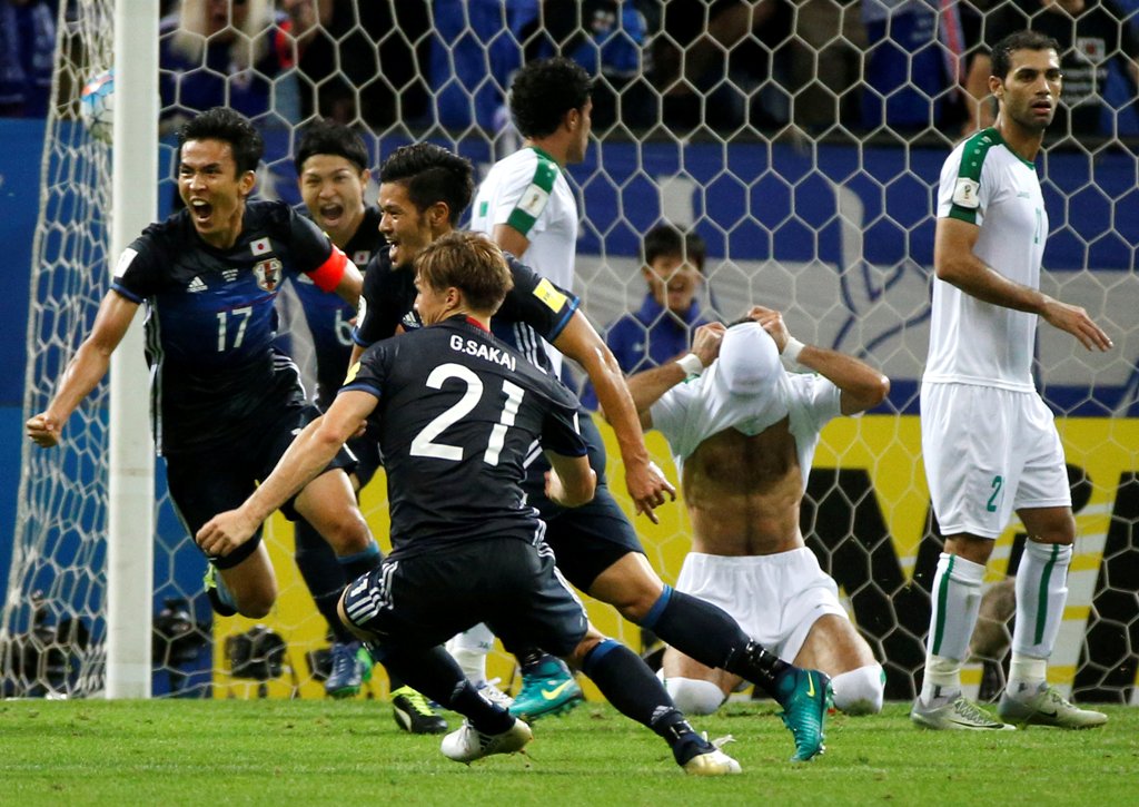 Saitama Stadium 2002, Saitama, Japan - 6/10/16. Japan's Hotaru Yamaguchi and teammates celebrate after scoring the second goal for Japan against Iraq. REUTERS/Issei Kato