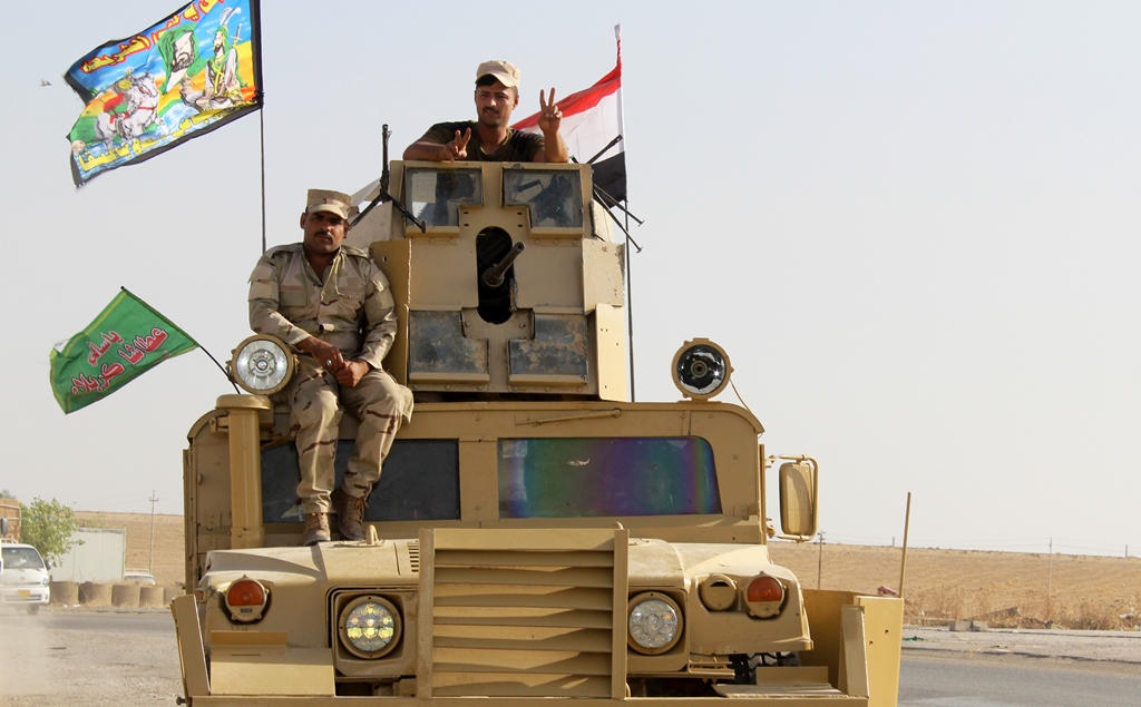 76th Brigade Command of Iraqi army forces move forward to Mahmour region of Mosul after leaving Kirkuk within the operation staging to retake Iraq's Mosul from Daesh terrorists, in Kirkuk, Iraq on October 11, 2016. (Hejar Resit / Anadolu Agency)