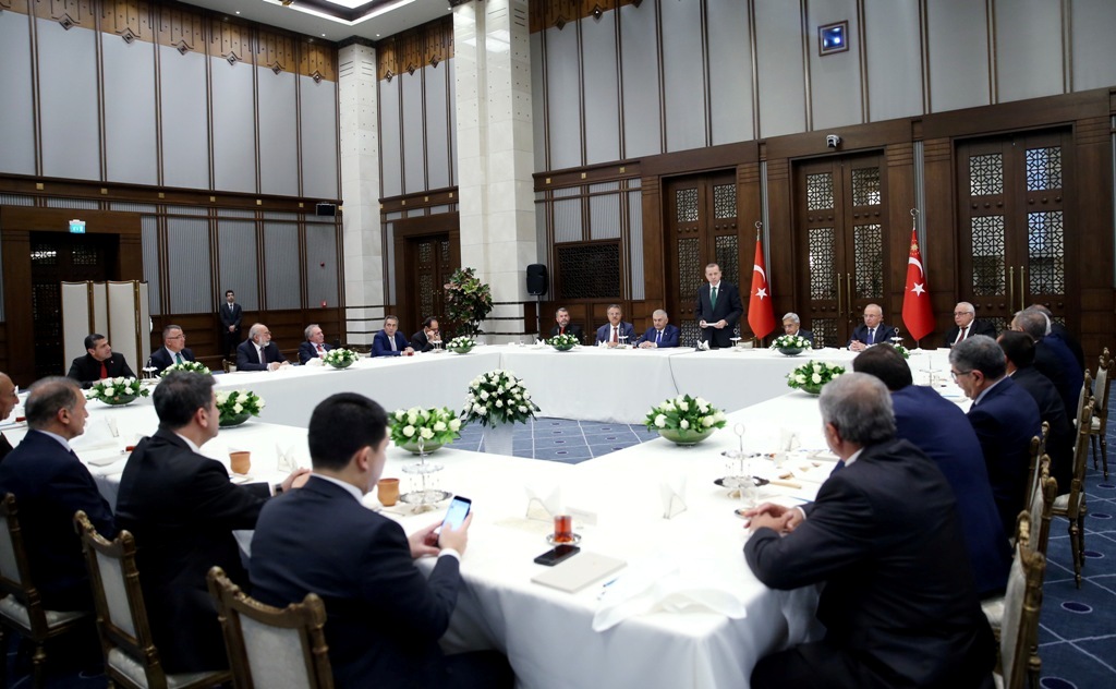 ANKARA, TURKEY - OCTOBER 11: Turkish President Recep Tayyip Erdogan (rear C) attends an Iftar dinner for Muharram month with Turkish Prime Minister Binali Yildirim at the Presidential Complex in Ankara, Turkey on October 11, 2016. 