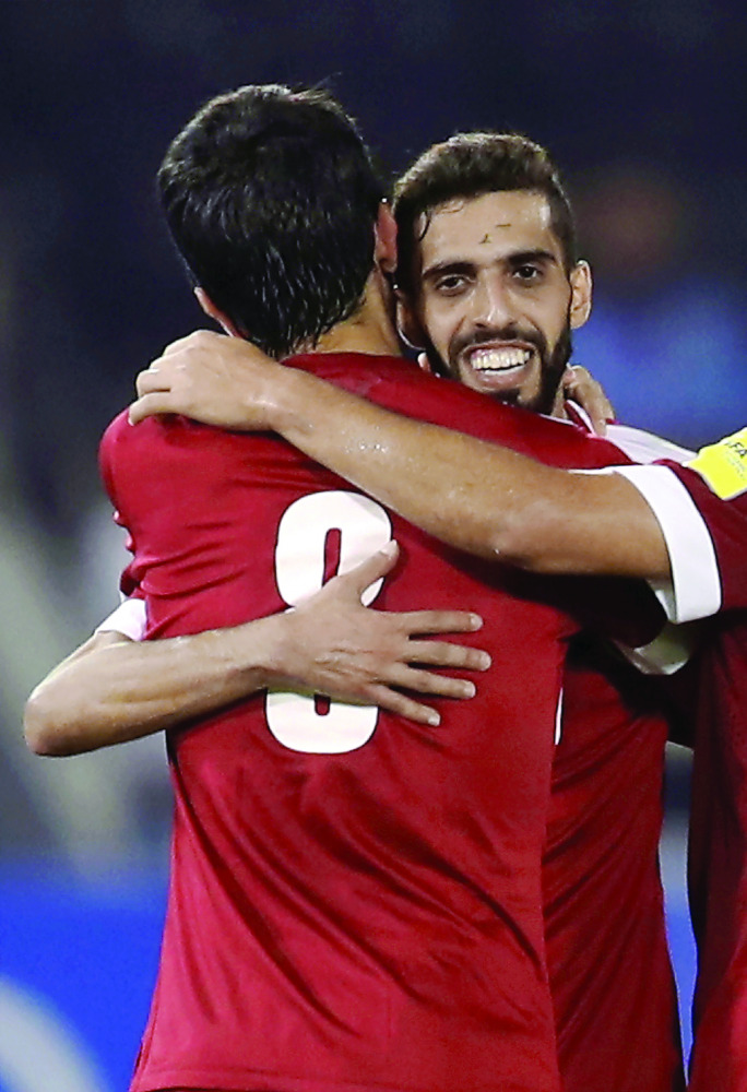 Qatar’s Hassan Al Haydos (right) celebrates his goal against Syria during the 2018 World Cup qualifier at the Jassim Bin Hamad Stadium, Doha. Qatar won 1-0.